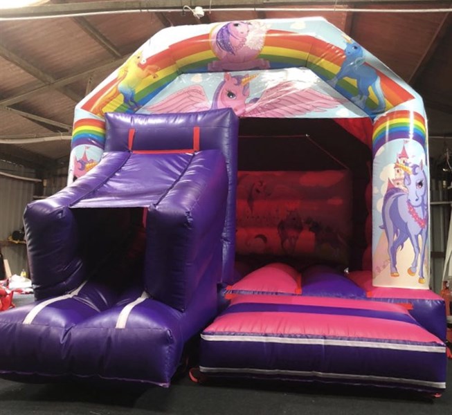 unicorns bouncy castle slide combo.